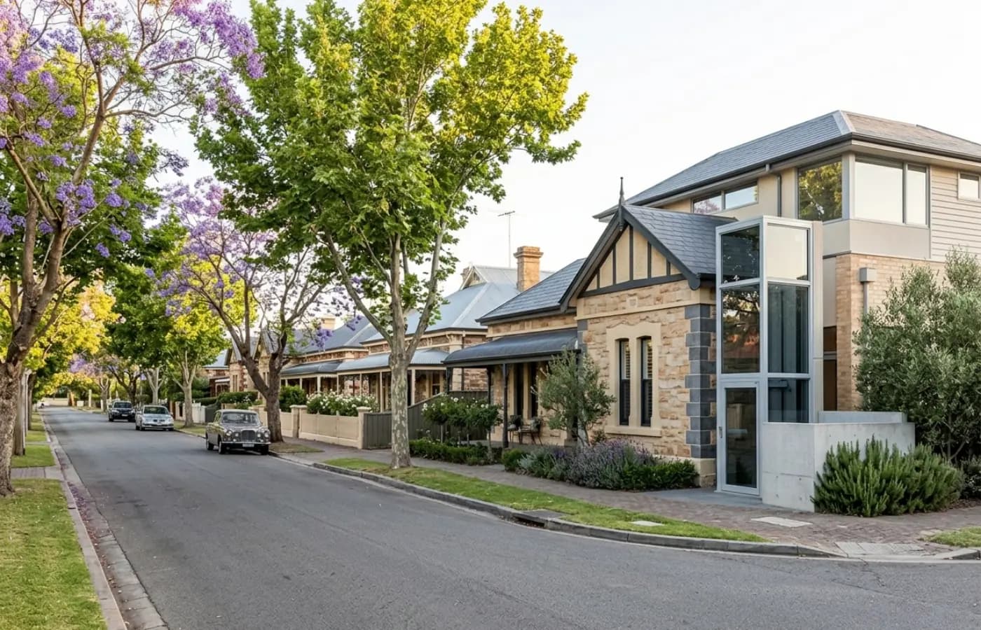 Sandstone villa with bluestone quoins on a tree-lined Adelaide street