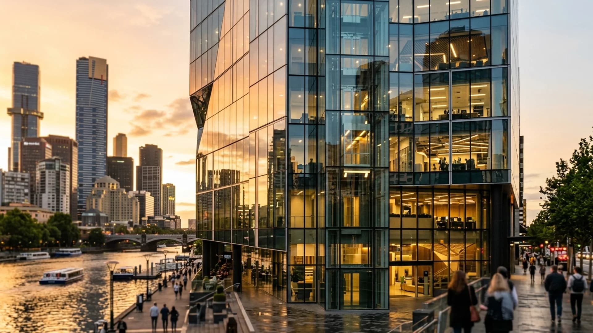 Modern glass-fronted commercial building in Melbourne's CBD at golden hour, contemporary architecture reflecting warm sunlight